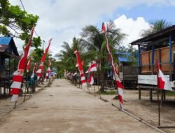 Jelang Kunjungan Tim Wasev, Satgas TMMD dan Warga Pasang Umbul Umbul, dan Menata Lingkungan.