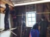 Satgas TMMD dan Warga Gotong Royong Pasang Rangka Dinding Gereja Santo Klemenst